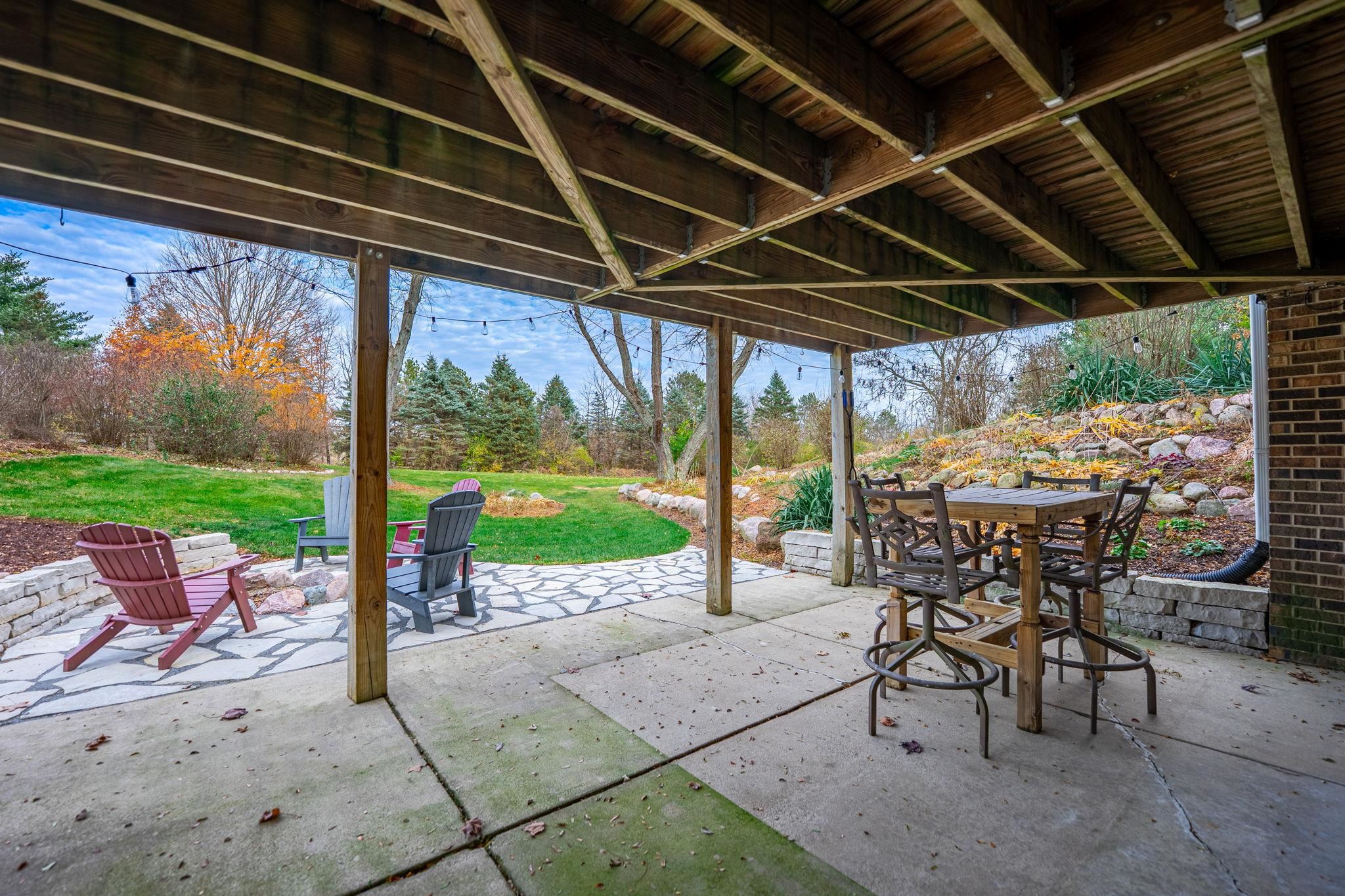 1628 Riverside Road Belvidere, IL 61008 - Photo 36 of 47 a view of a patio with a table chairs and backyard