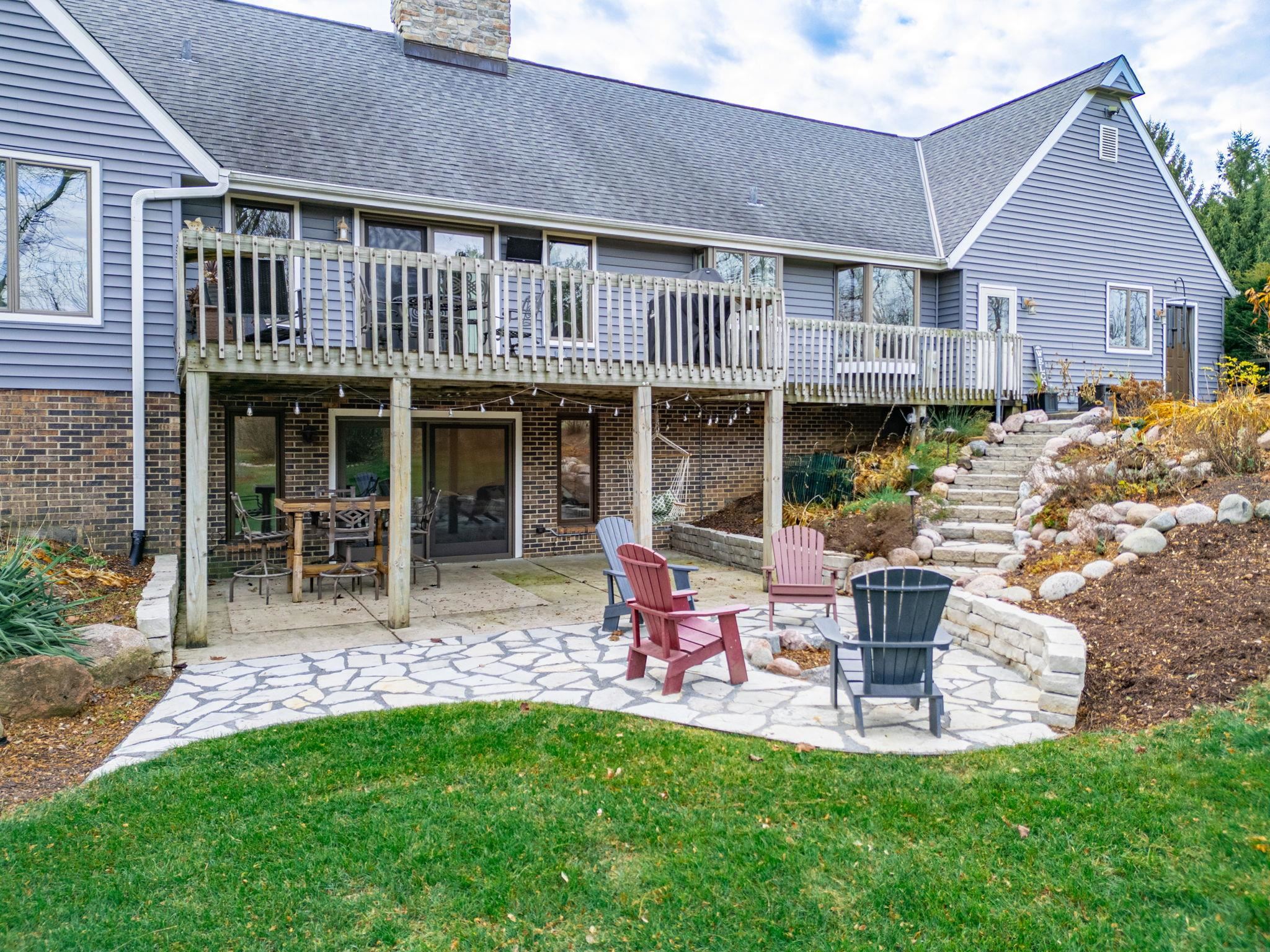 1628 Riverside Road Belvidere, IL 61008 - Photo 38 of 47 a front view of a house with a garden and sitting area