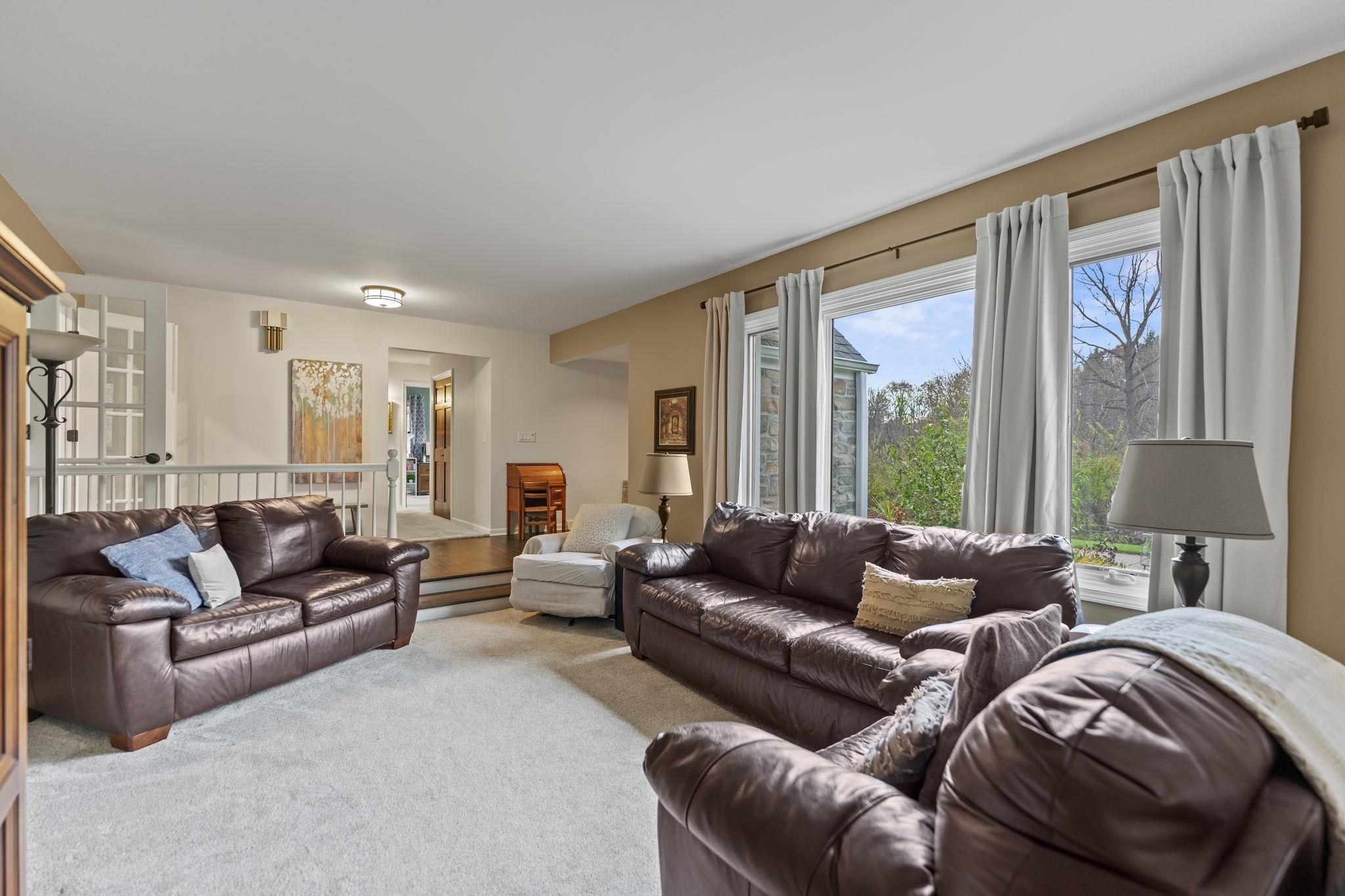 1628 Riverside Road Belvidere, IL 61008 - Photo 8 of 47 a living room with furniture and a large window