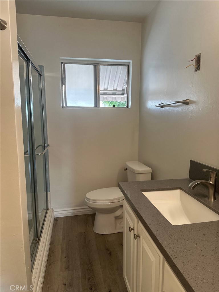 4533 Colbath Avenue, Unit 20 Sherman Oaks, CA 91423 - Photo 14 of 22 a bathroom with a sink toilet and a mirror