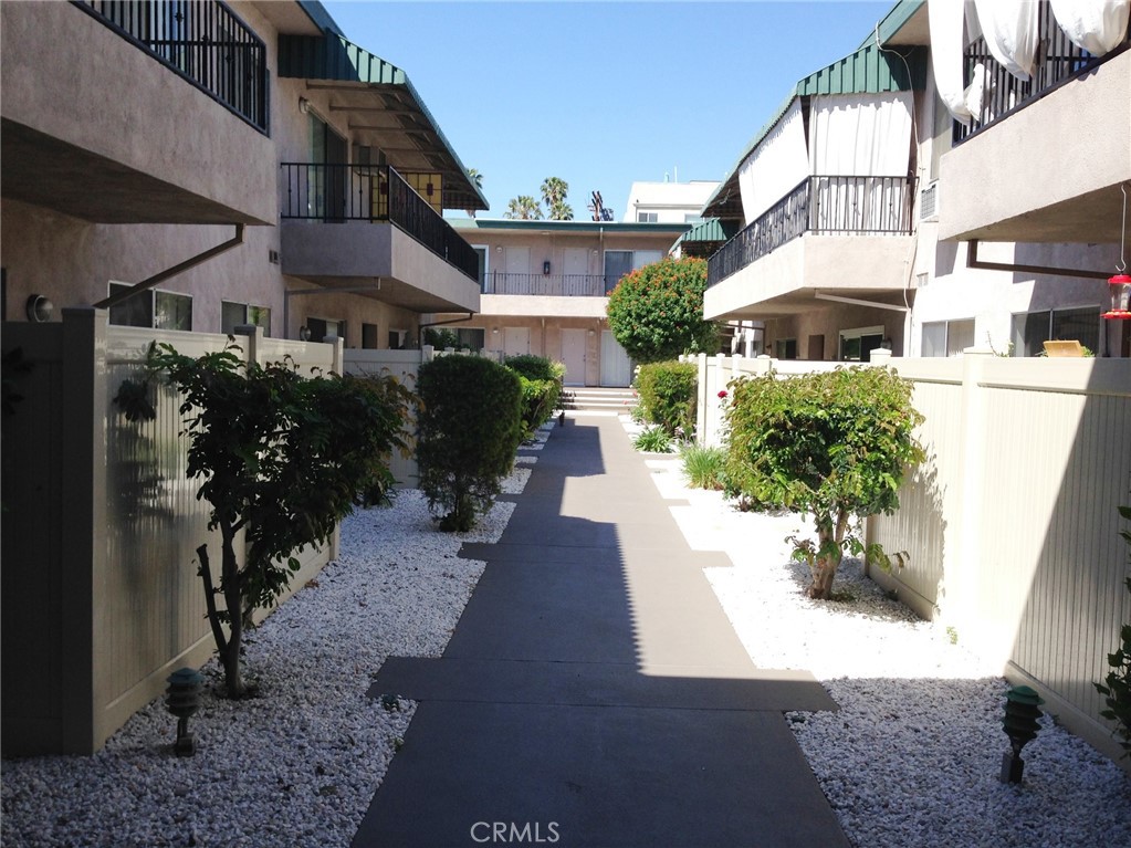 4533 Colbath Avenue, Unit 20 Sherman Oaks, CA 91423 - Photo 19 of 22 a front view of a house with a yard