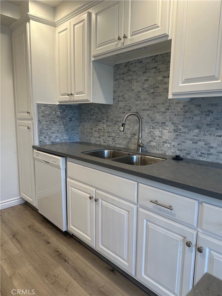 4533 Colbath Avenue, Unit 20 Sherman Oaks, CA 91423 - Photo 5 of 22 a kitchen with white cabinets