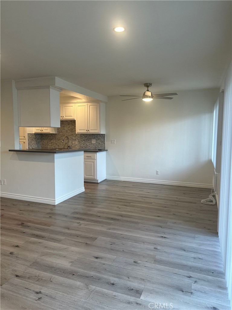 4533 Colbath Avenue, Unit 20 Sherman Oaks, CA 91423 - Photo 8 of 22 a view of kitchen and wooden floor
