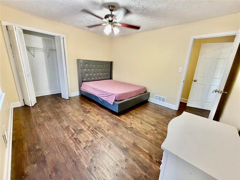 665 Arnold Road Lawrenceville, GA 30044 - Photo 30 of 48 a bedroom with a bed and a walk in closet