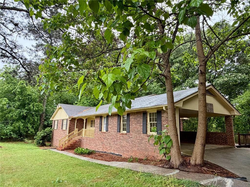 665 Arnold Road Lawrenceville, GA 30044 - Photo 44 of 48 front view of a house with a yard