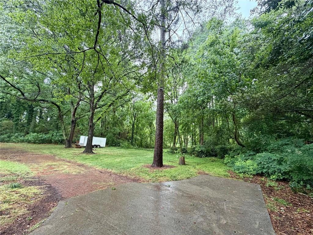 665 Arnold Road Lawrenceville, GA 30044 - Photo 46 of 48 a green field with lots of trees in the background
