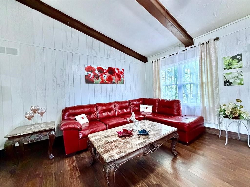 665 Arnold Road Lawrenceville, GA 30044 - Photo 7 of 48 a living room with furniture and wooden floor