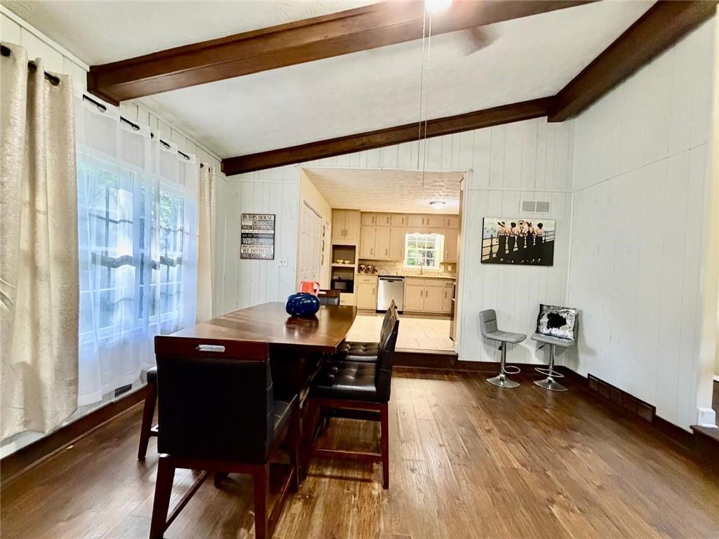 665 Arnold Road Lawrenceville, GA 30044 - Photo 8 of 48 a dining room with furniture and wooden floor