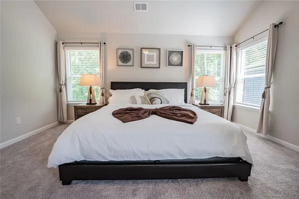 a bedroom with a bed and window