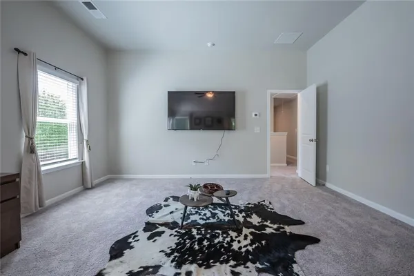 a living room with a flat screen tv