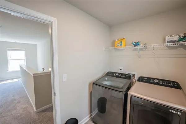 a utility room with dryer and washer