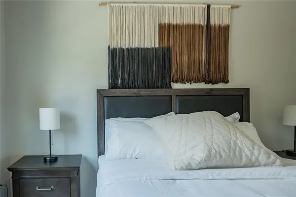 a bedroom with a bed and a table