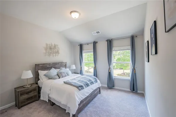 a bedroom with a bed and a closet