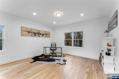 a bathroom with a shower sink and mirror