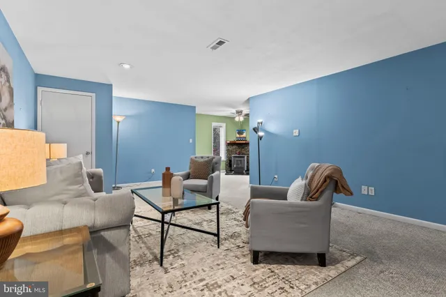 a living room with furniture and rug