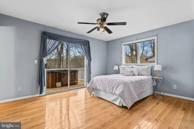 a bedroom with a large bed and a large window