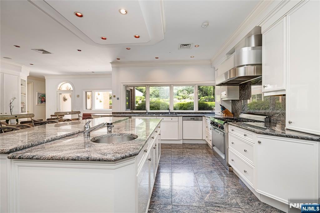 67 Adams Drive Cresskill, NJ 07626 - Photo 15 of 45 a kitchen with counter space sink stove and cabinets