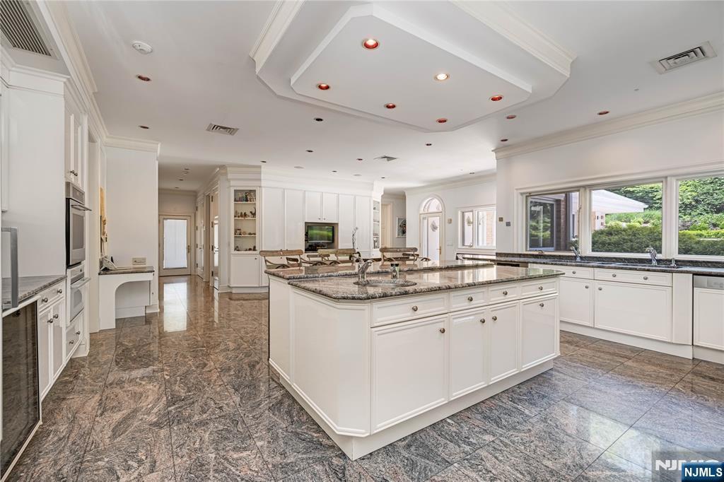 67 Adams Drive Cresskill, NJ 07626 - Photo 17 of 45 a large white kitchen with a large window