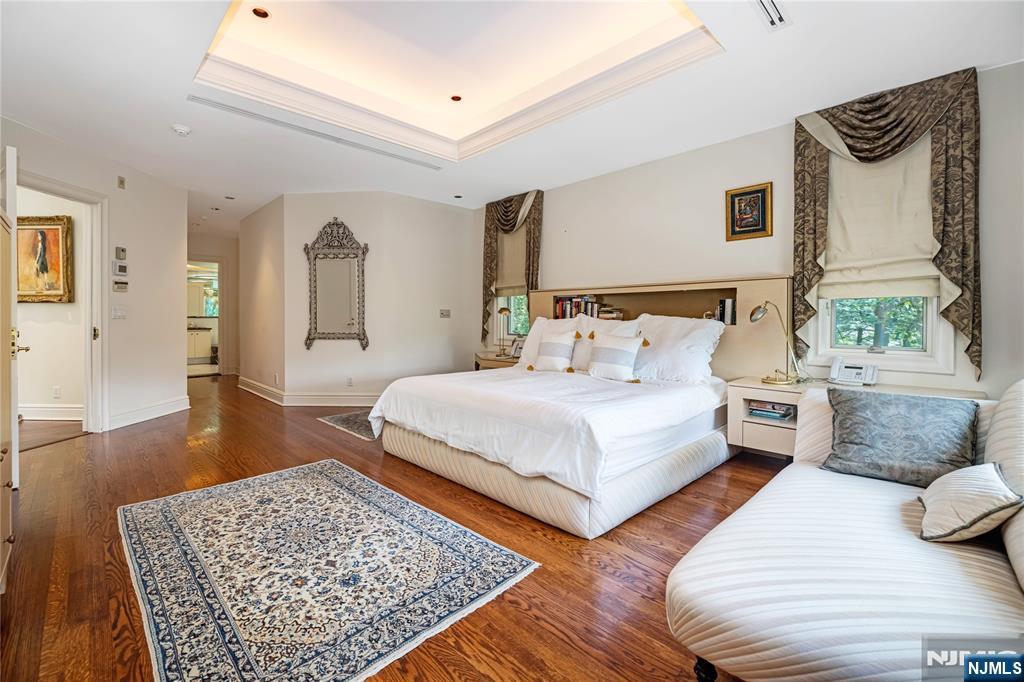 67 Adams Drive Cresskill, NJ 07626 - Photo 22 of 45 a bedroom with a bed a couch and a dresser