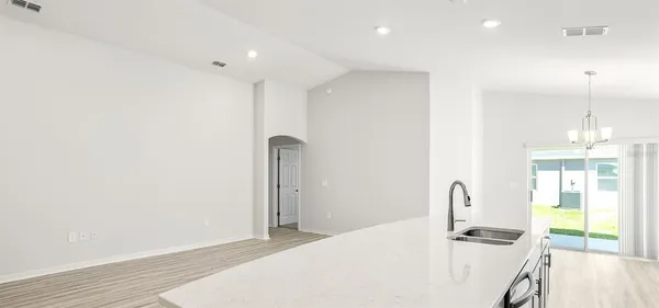 a kitchen with stainless steel appliances a refrigerator and a stove