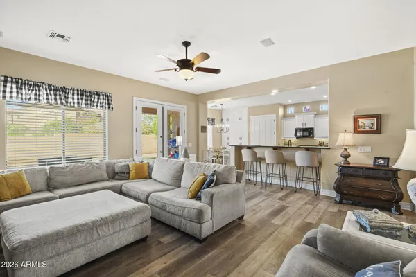 a living room with furniture and a large window