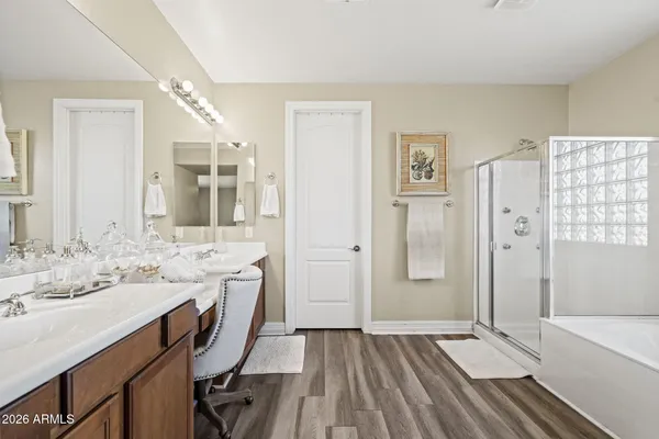 a bathroom with a sink a mirror and a bathtub