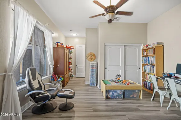 a view of a workspace with furniture and toys