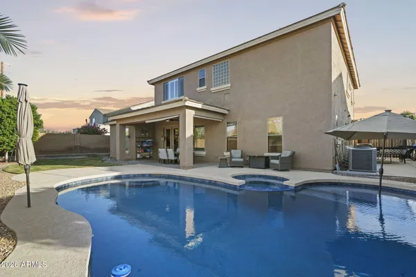 a view of pool with outdoor seating