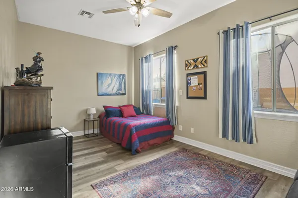 a living room with a bed furniture and a window