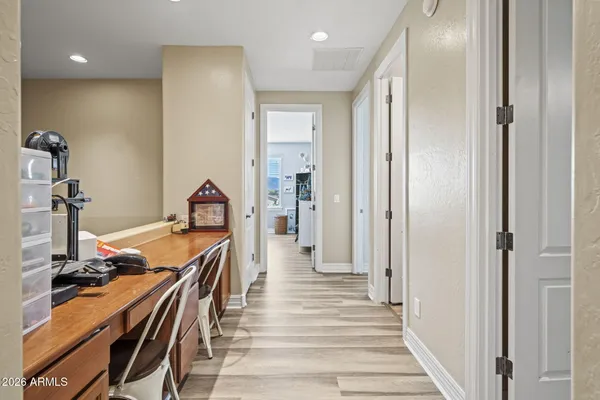a view of a hallway with a livingroom and entryway
