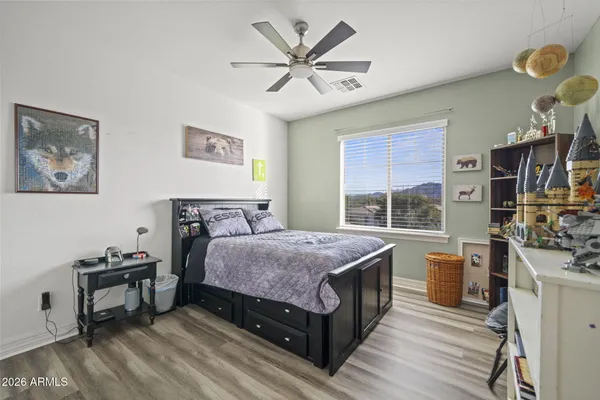 a bedroom with a bed and a table in it