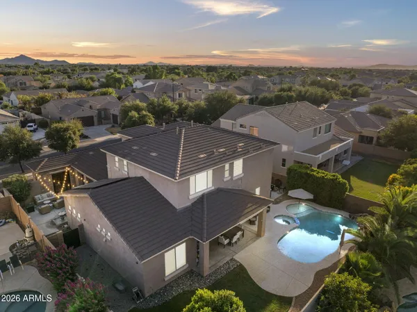 an aerial view of a house with a mountain view