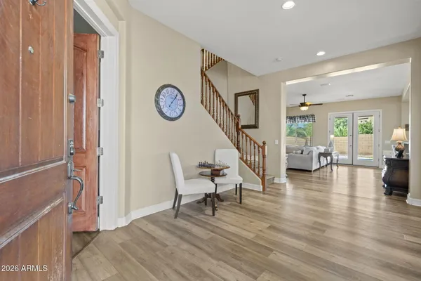 a view of a livingroom with furniture and hardwood floor