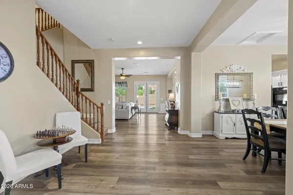 a view of a livingroom with furniture and hardwood floor