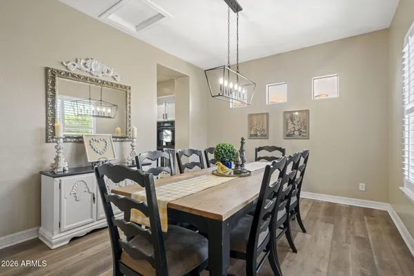 a view of a dining room with furniture window and wooden floor