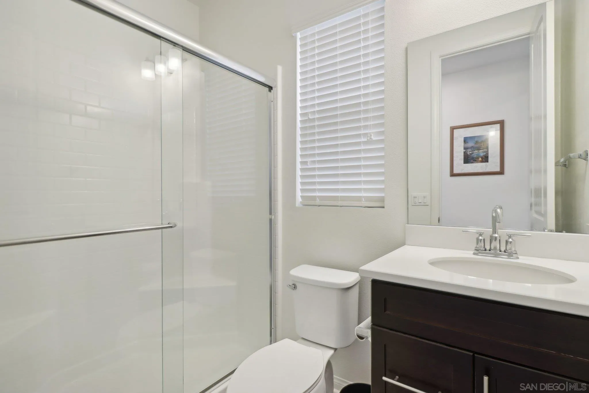10645 Rhodes Lane Spring Valley, CA 91978 - Photo 14 of 38 a bathroom with a sink toilet and vanity
