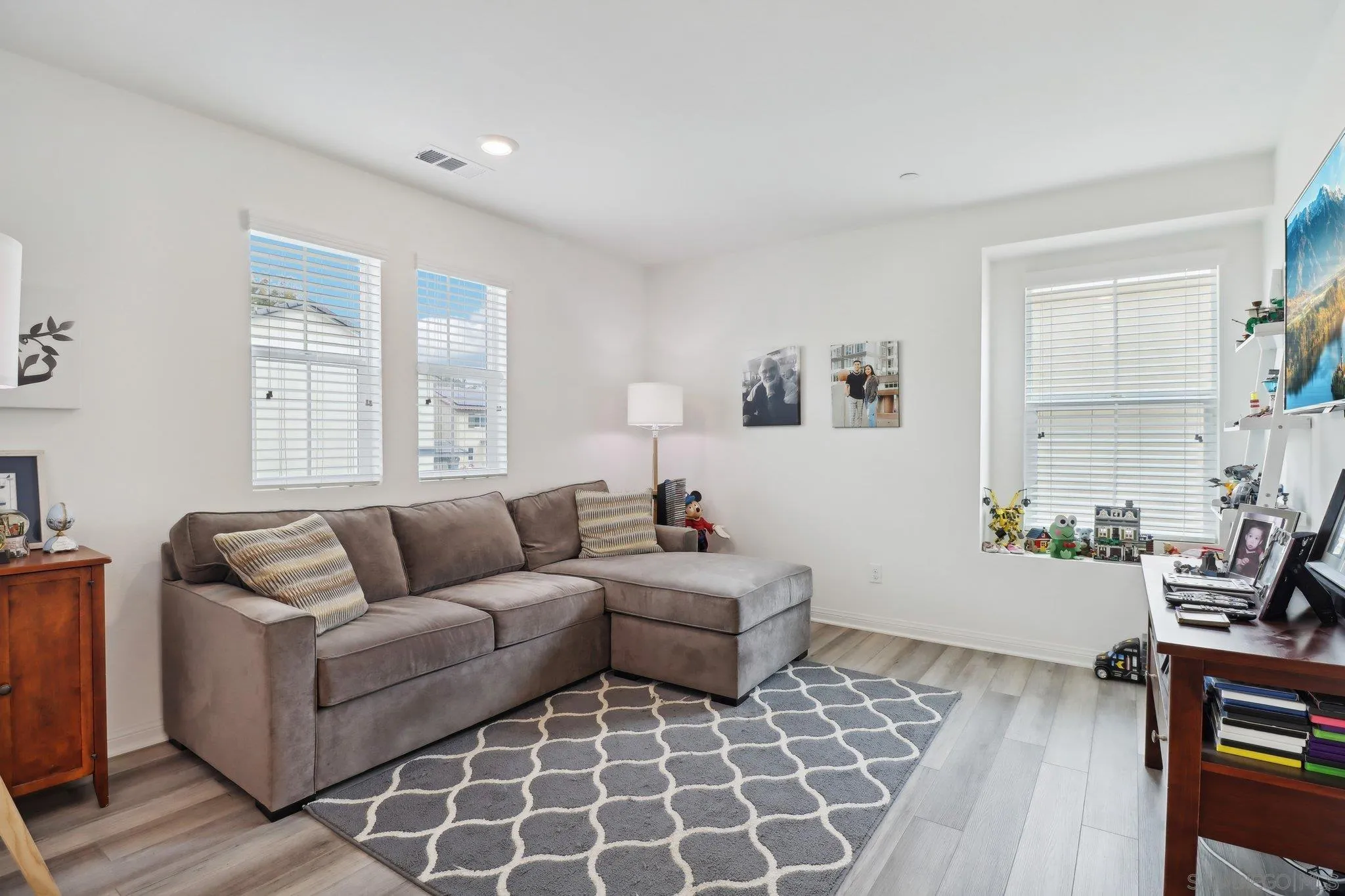 10645 Rhodes Lane Spring Valley, CA 91978 - Photo 18 of 38 a living room with furniture and a window