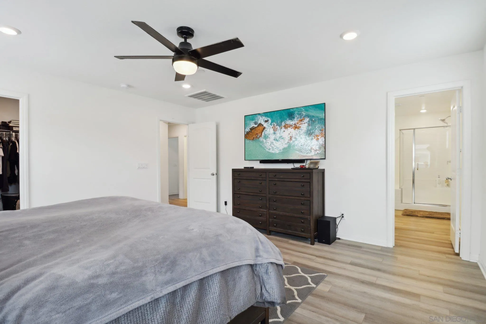 10645 Rhodes Lane Spring Valley, CA 91978 - Photo 22 of 38 a bedroom with a bed and wooden floor