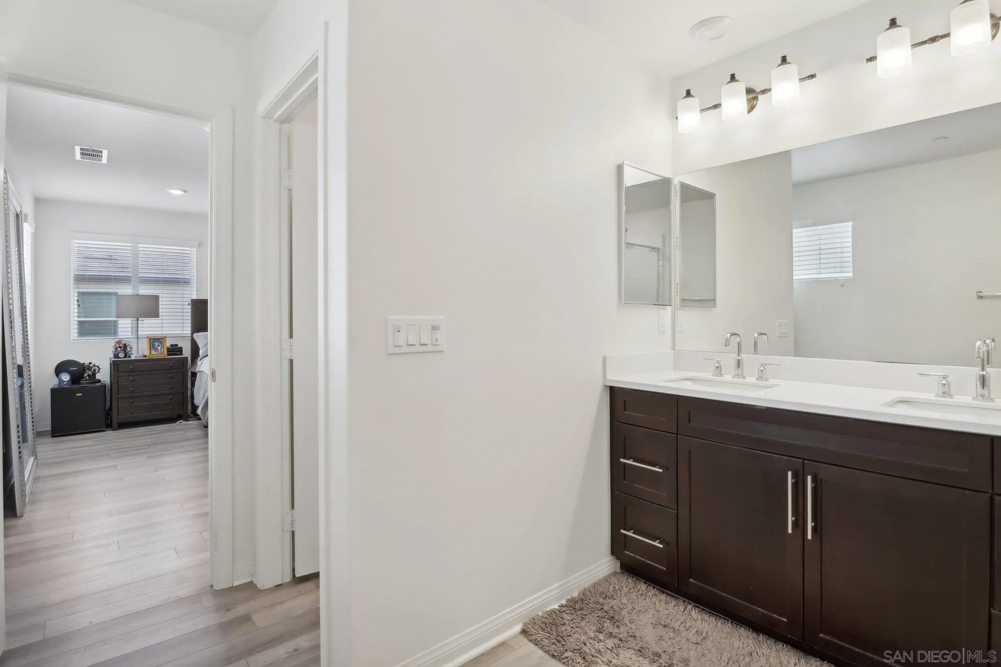 10645 Rhodes Lane Spring Valley, CA 91978 - Photo 25 of 38 a en suite bathroom with a sink double vanity and a mirror
