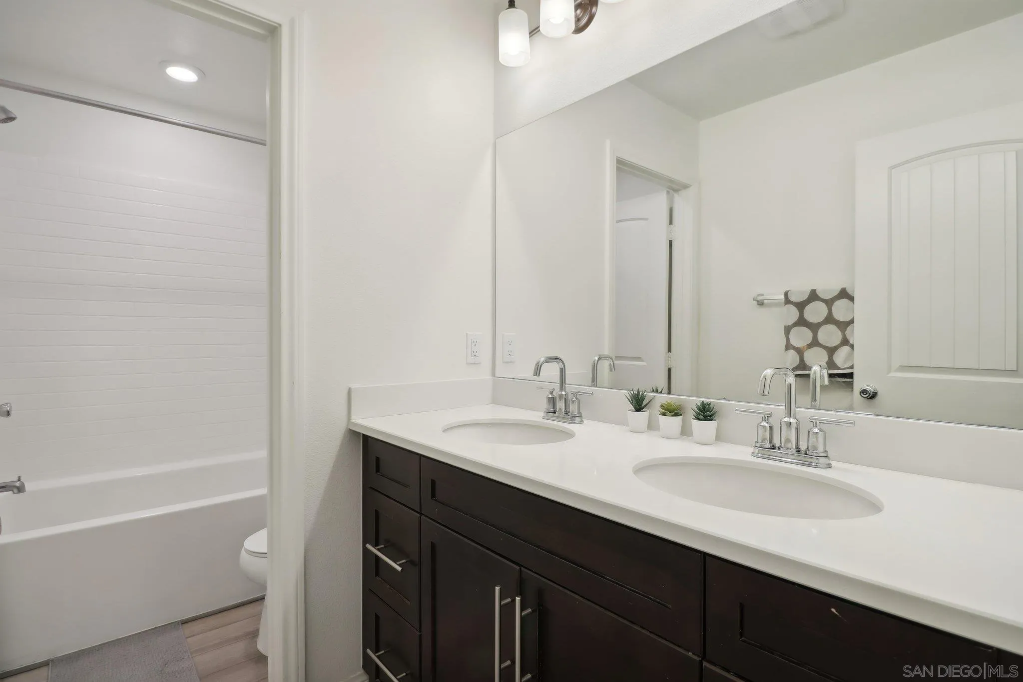 10645 Rhodes Lane Spring Valley, CA 91978 - Photo 26 of 38 a bathroom with a granite countertop sink toilet and a bathtub