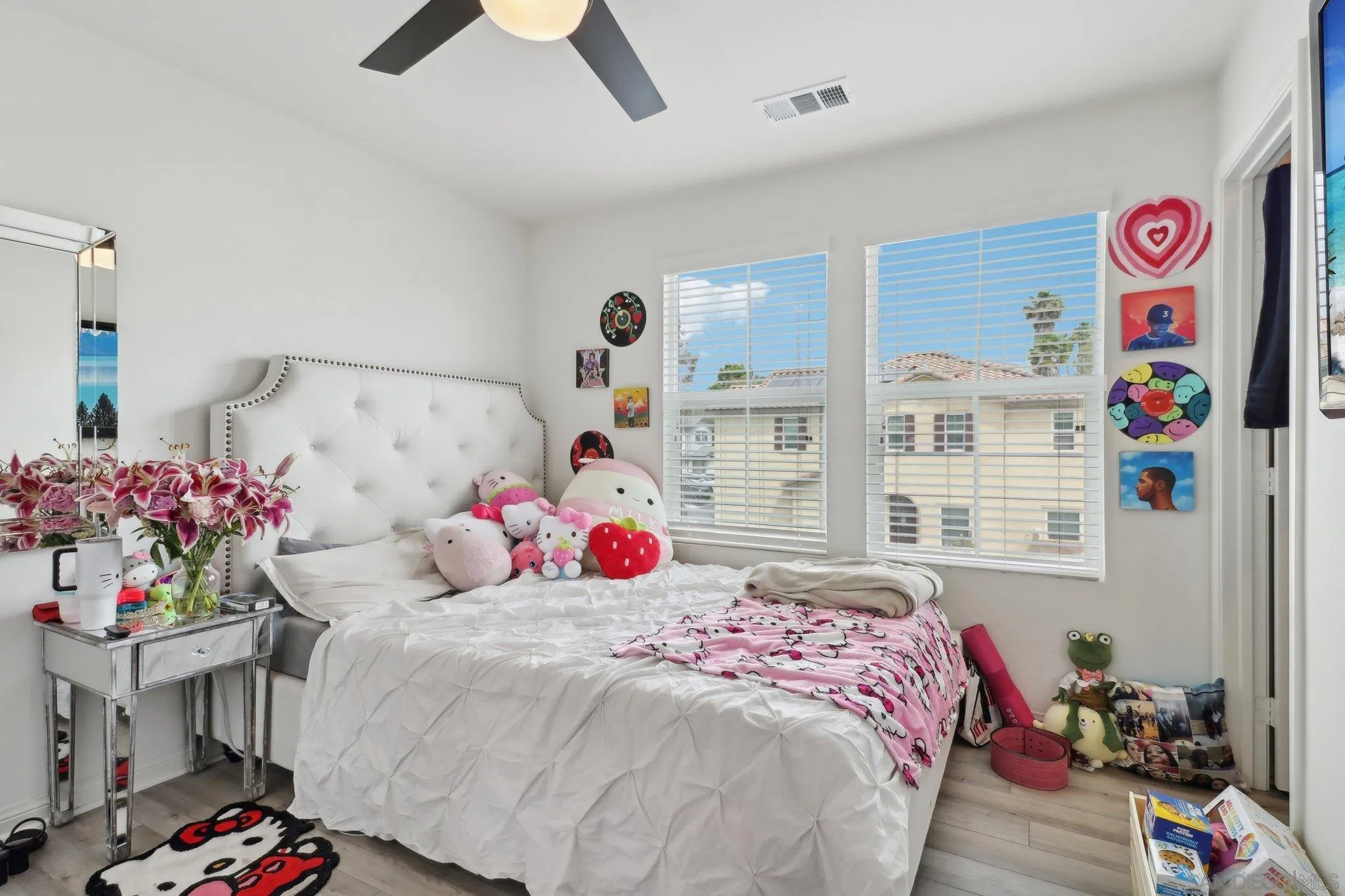 10645 Rhodes Lane Spring Valley, CA 91978 - Photo 31 of 38 a bedroom with bed and a chandelier