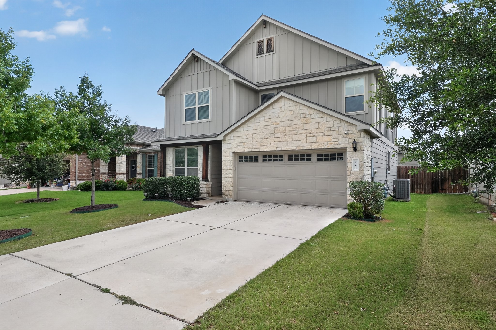 521 Staton Street Georgetown, TX 78626 - Photo 2 of 39 a front view of a house with a yard and garage