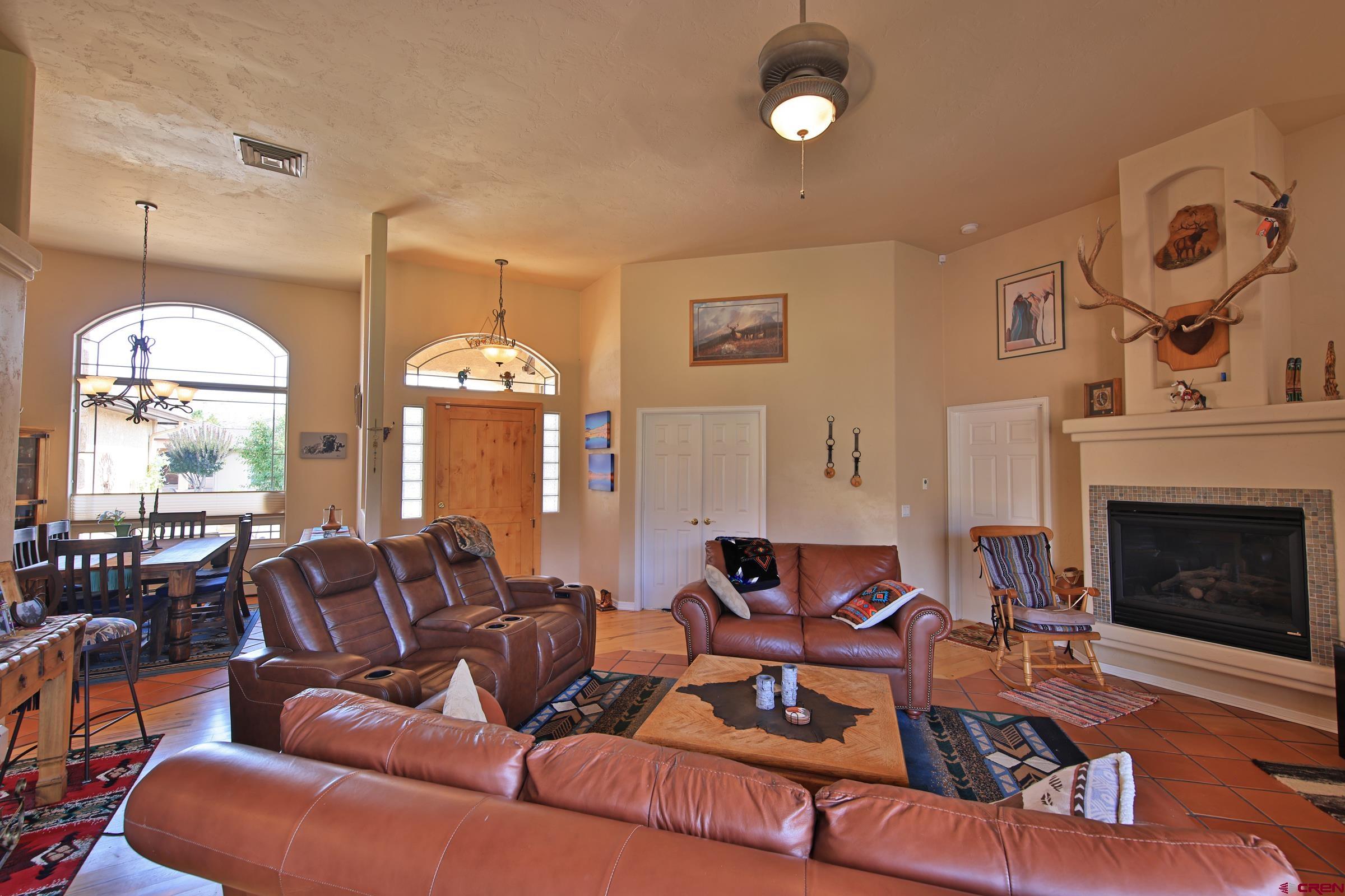 339 Canyon Rim Court Grand Junction, CO 81507 - Photo 11 of 40 a living room with furniture fireplace and window