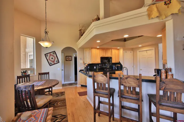a dining room with furniture and a chandelier