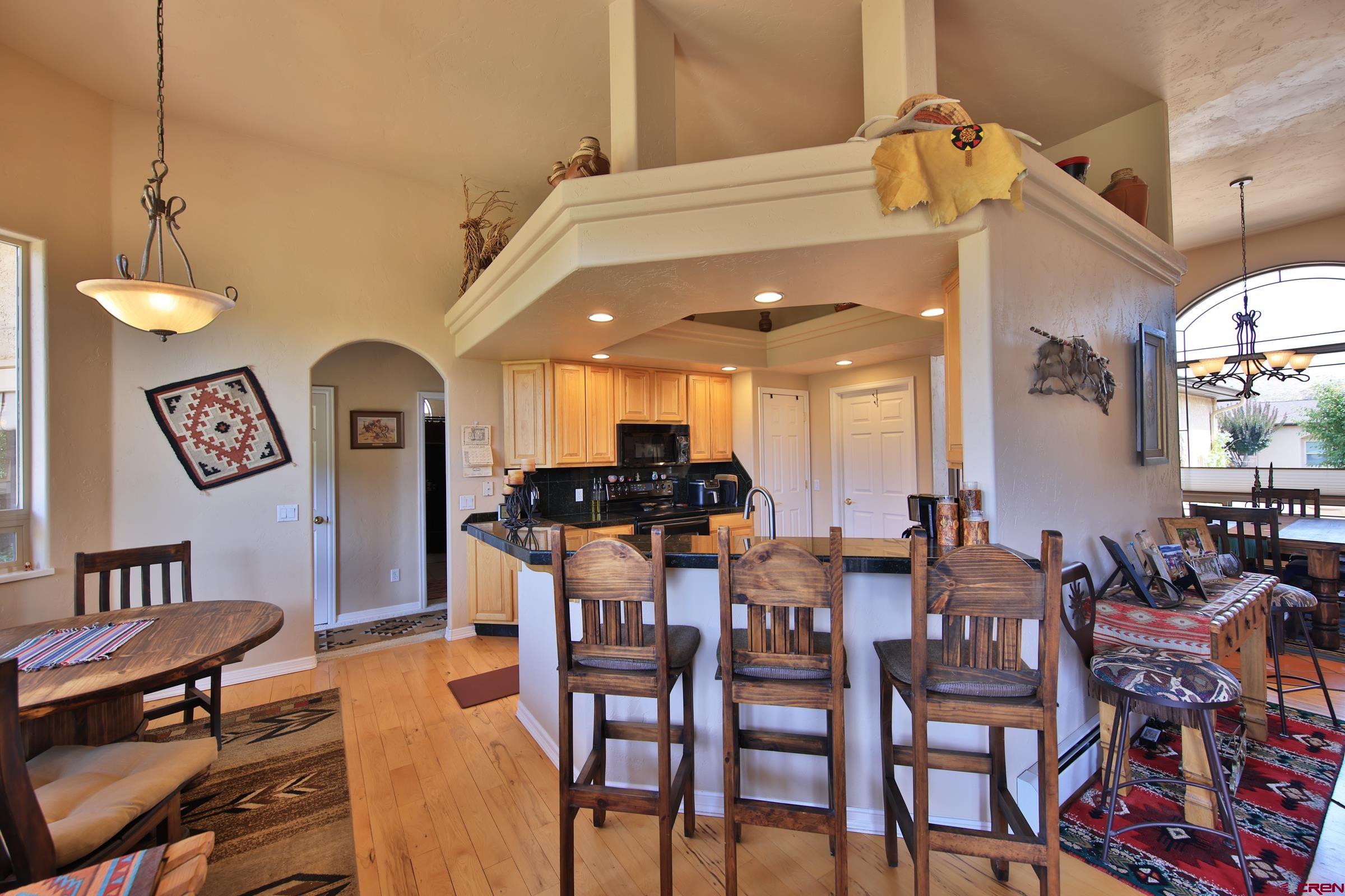339 Canyon Rim Court Grand Junction, CO 81507 - Photo 16 of 40 a view of a dining room with furniture