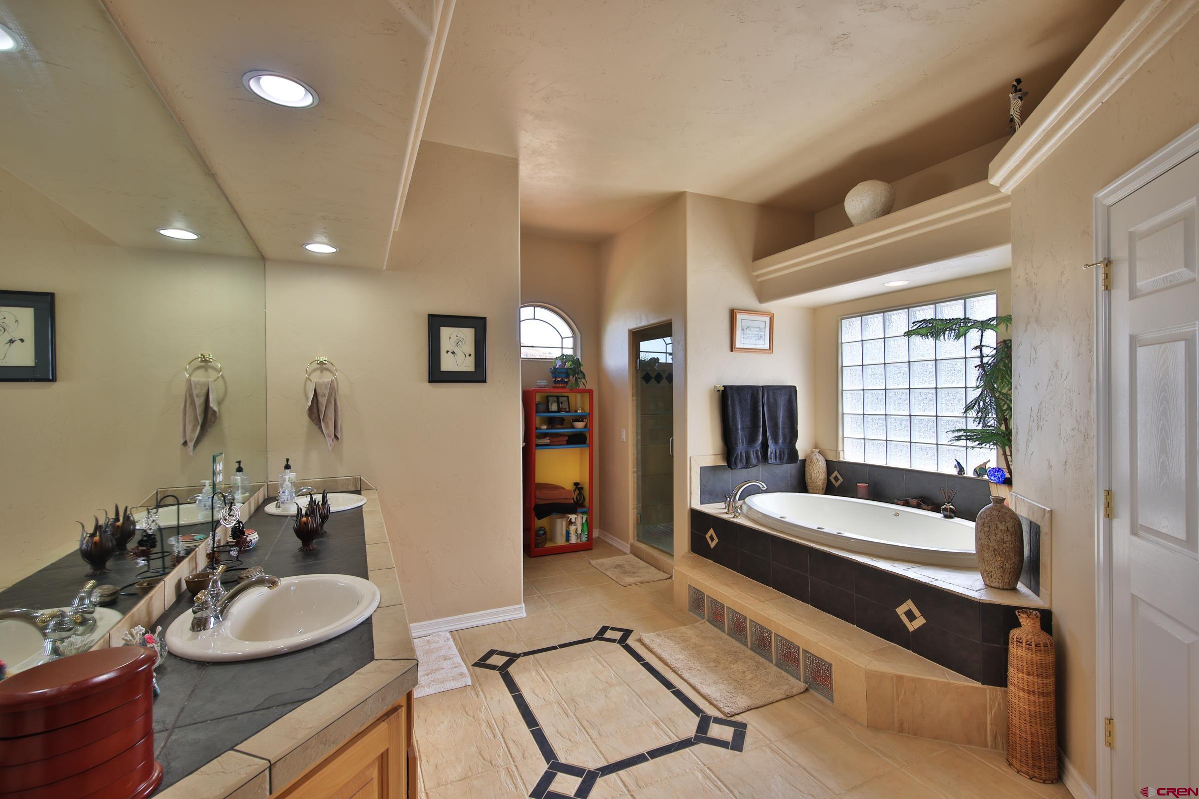 339 Canyon Rim Court Grand Junction, CO 81507 - Photo 23 of 40 a living room with furniture and a window