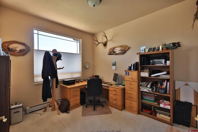 a view of a workspace with furniture