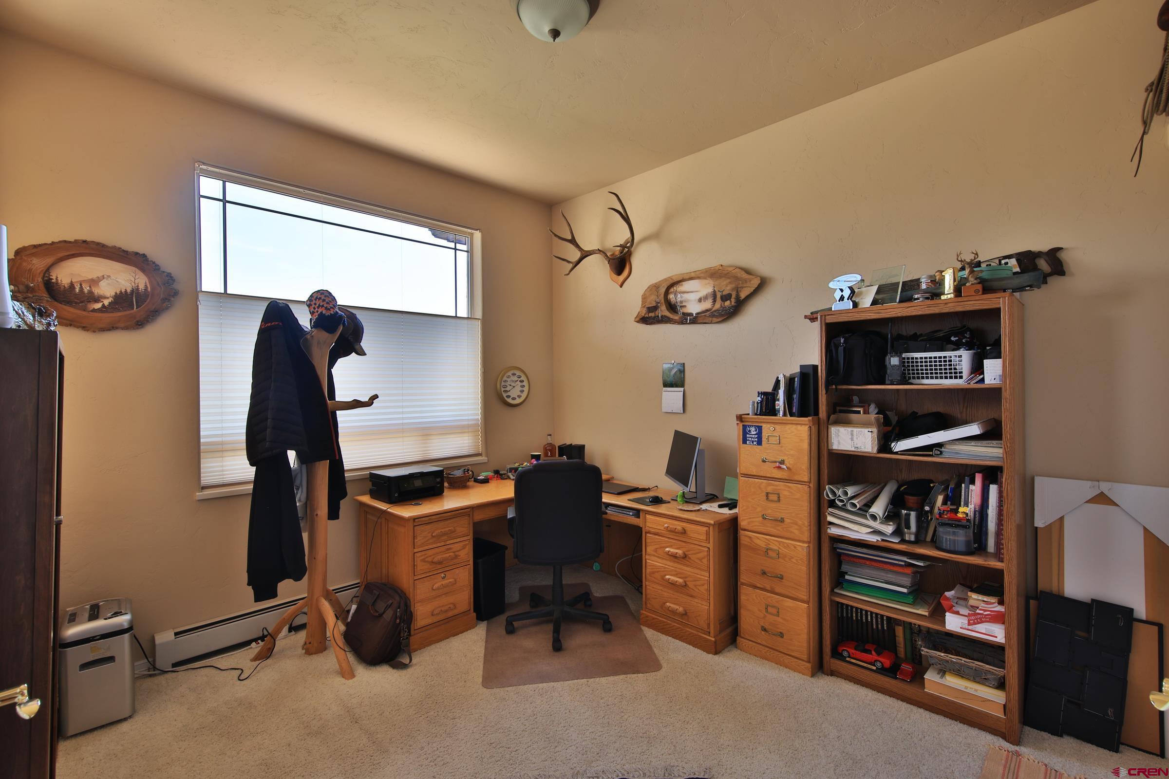 339 Canyon Rim Court Grand Junction, CO 81507 - Photo 24 of 40 a view of a workspace with furniture