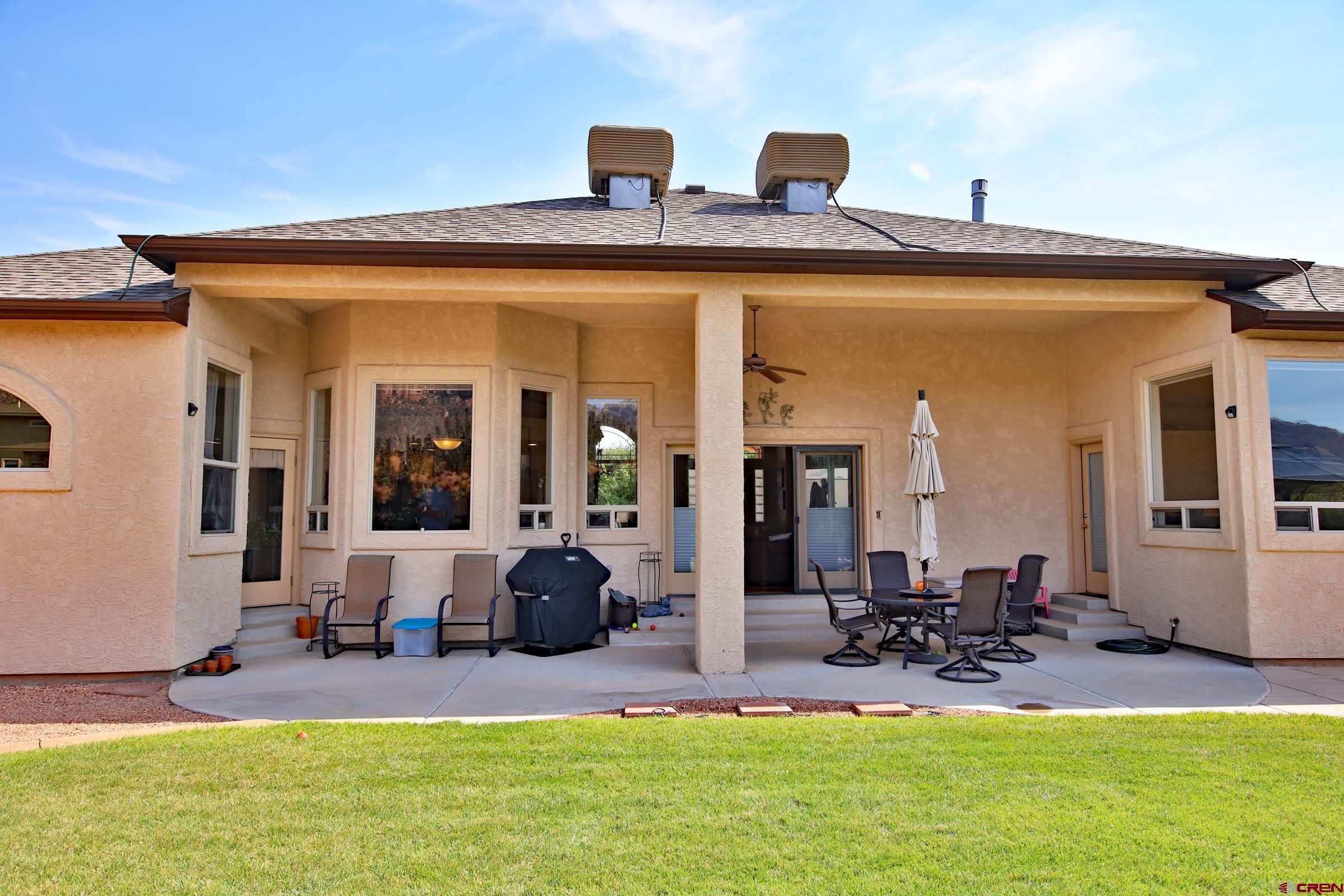 339 Canyon Rim Court Grand Junction, CO 81507 - Photo 29 of 40 a view of a front door and swimming pool