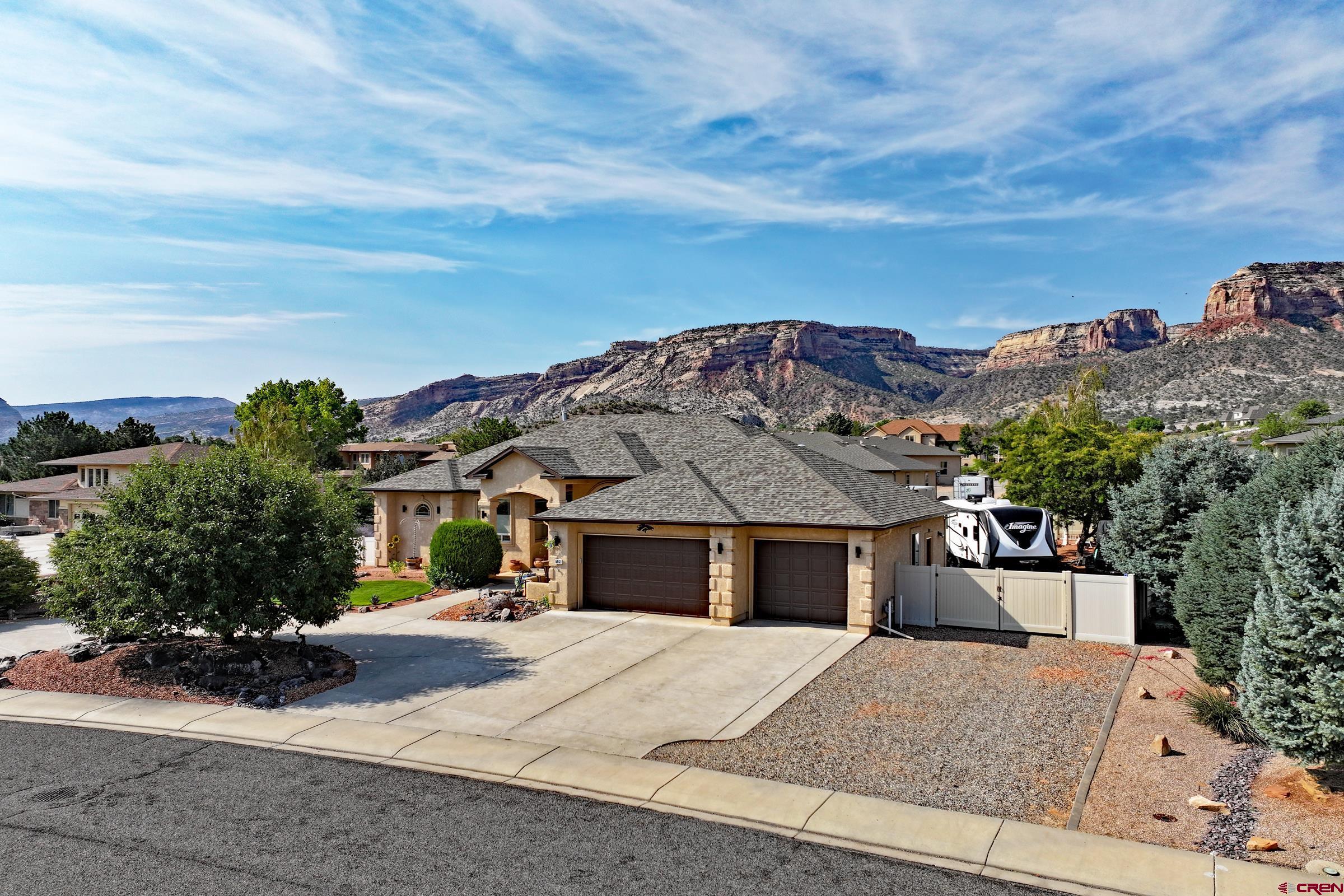 339 Canyon Rim Court Grand Junction, CO 81507 - Photo 3 of 40 front view of a house with a yard